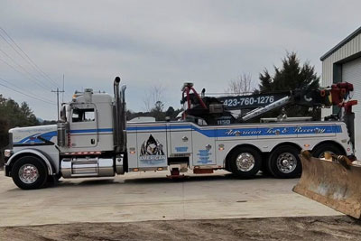 Rotator Service American Tow and Recovery Rotator in front of Shop Chattanooga Tennessee