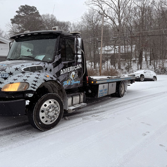 Rotator Service American Tow and Recovery Chattanooga Tennessee Tow Truck Winching Car stuck in snow