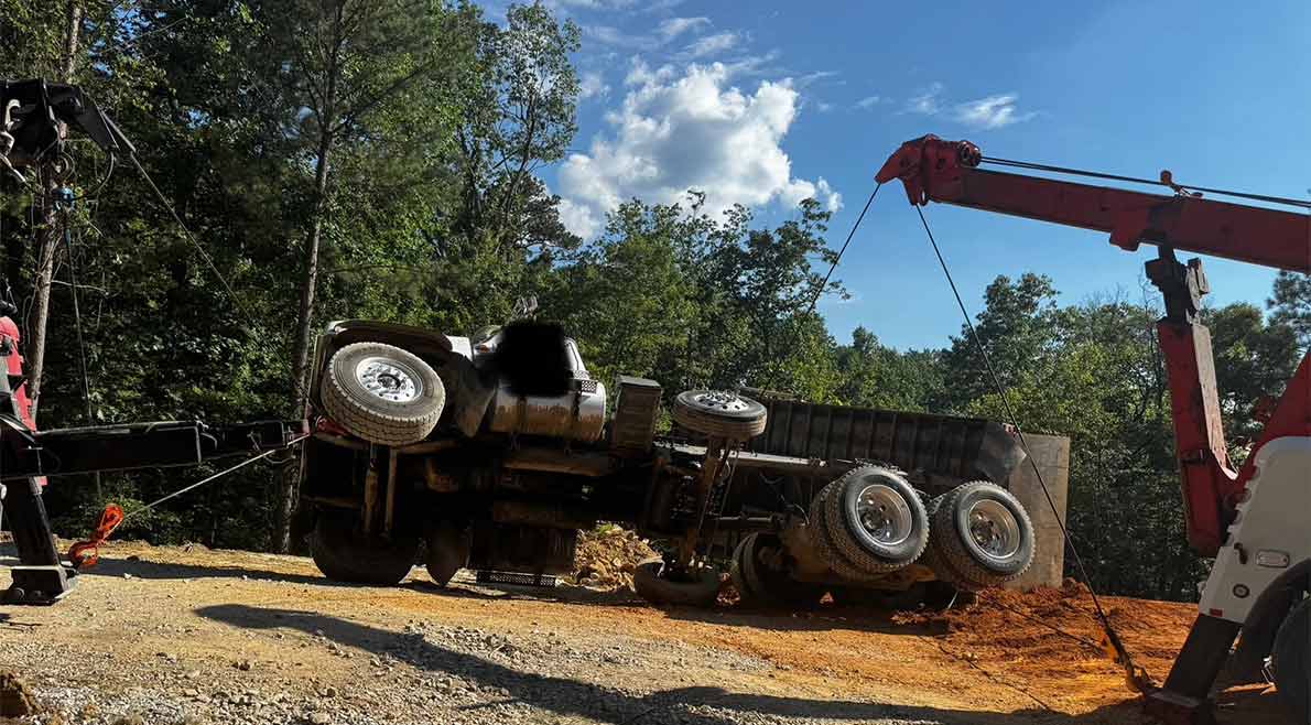 heavy-recovery-wrecker-off-road-recovery Wrecker performing heavy recovery of an overturned truck off the roadway in Marion County.