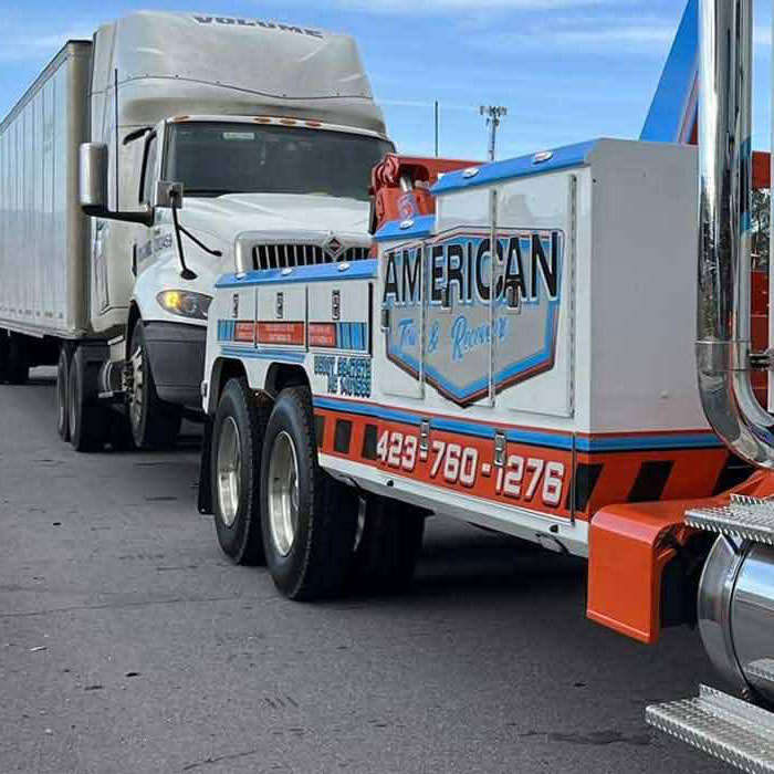 monteagle-mountain-flatbed-tow-truck-sedan-i-24 Flatbed tow truck hauling a passenger car near Monteagle Mountain, I-24 West